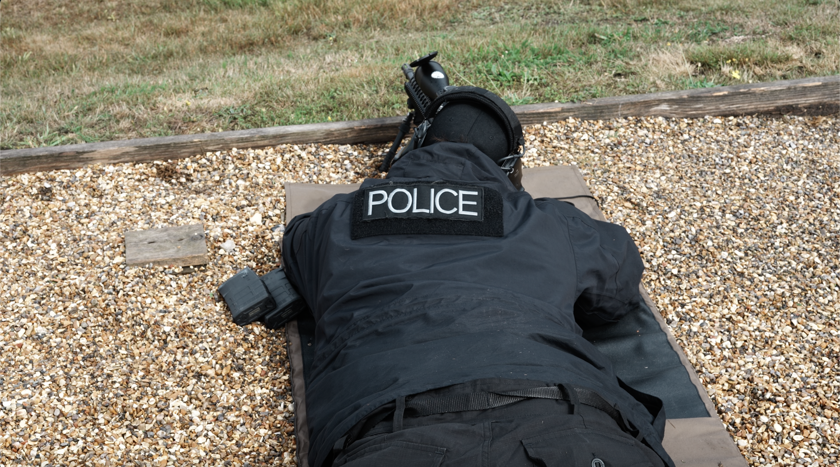 Professional arm hero. Single strong still: instructor working, kit in use, or environmental wide. Not posed.