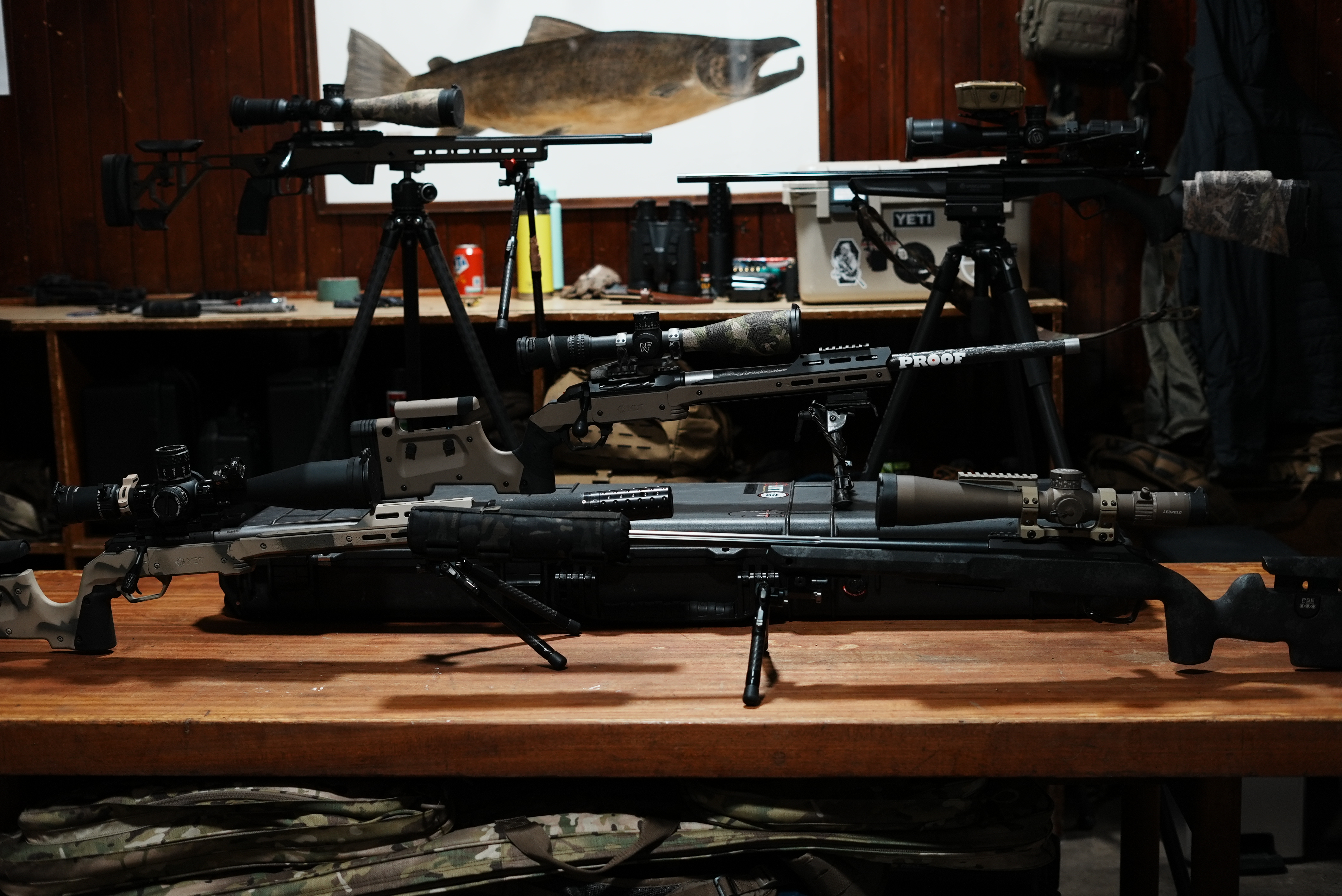 RFD intro still: rifles in rack, kit on bench, or shopfront context. Tone: professional, matter-of-fact.